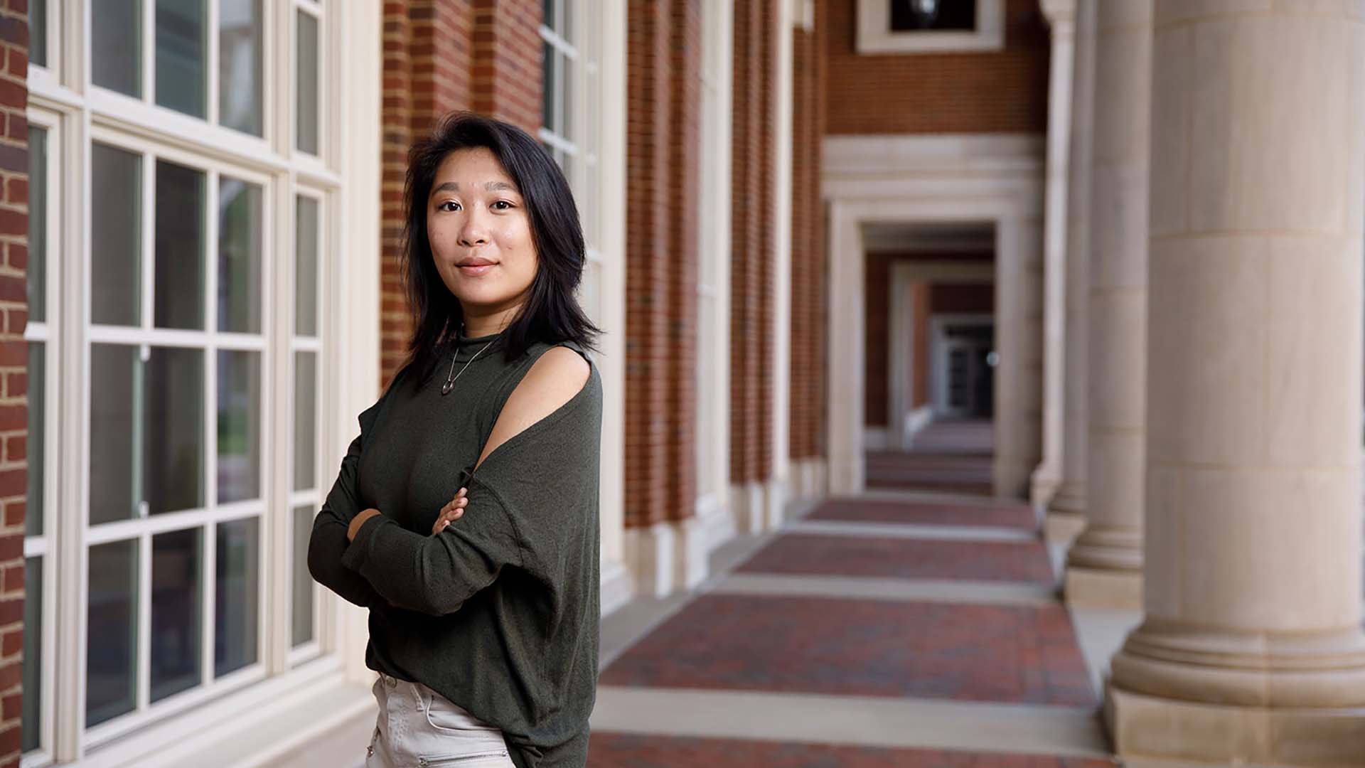 Lauren Pan standing outside in a corridor area of shelby hall